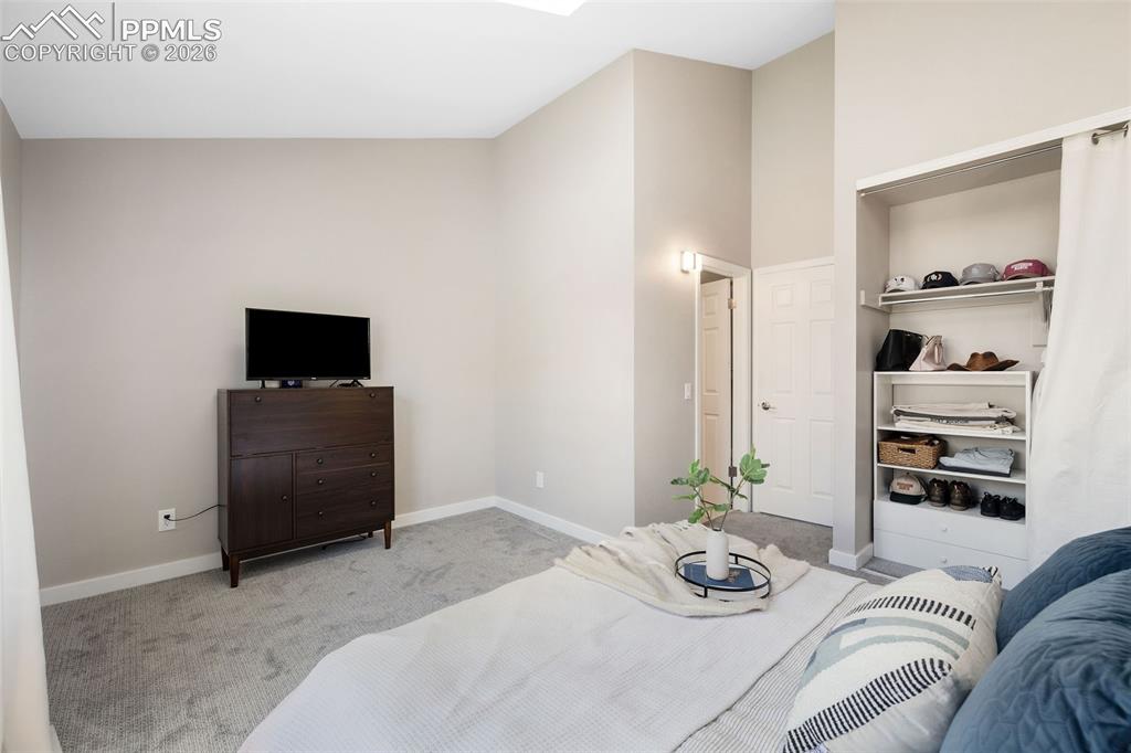 Image 22 of 26: Carpeted room featuring light neutral wall paint and white trim, an integra
