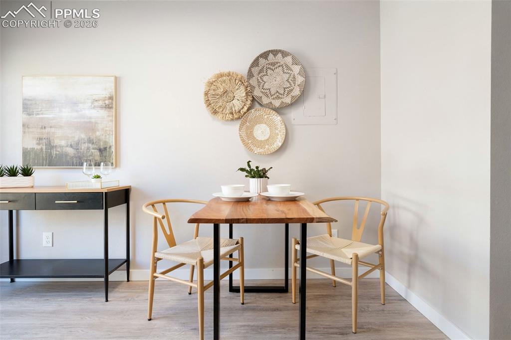 Image 8 of 26: Dining area with wood-finish flooring