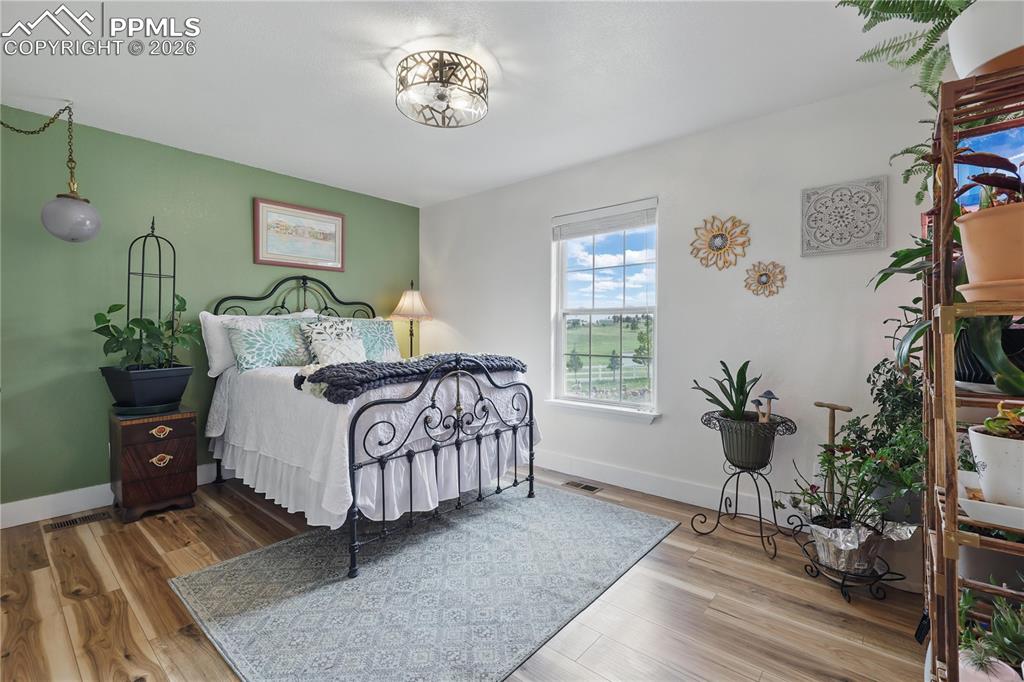 Image 17 of 43: Main level, front bedroom.