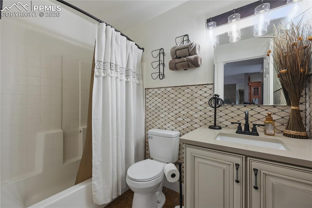 Image 18 of 43: Main level full bathroom.