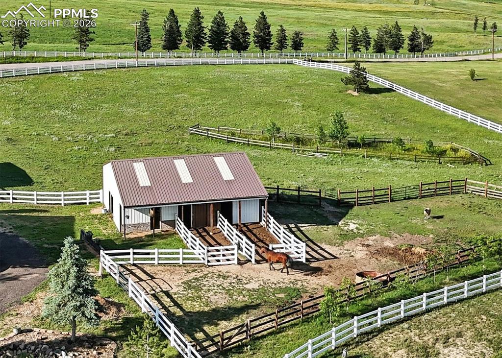Image 35 of 43: 30x40 barn is fully equipped with two Priefert horse stalls, water and elec