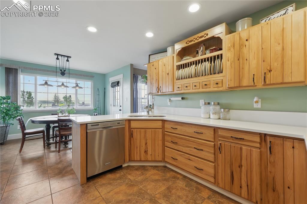 Image 7 of 43: Kitchen features hickory cabinets, new quartz countertops, stainless steel 