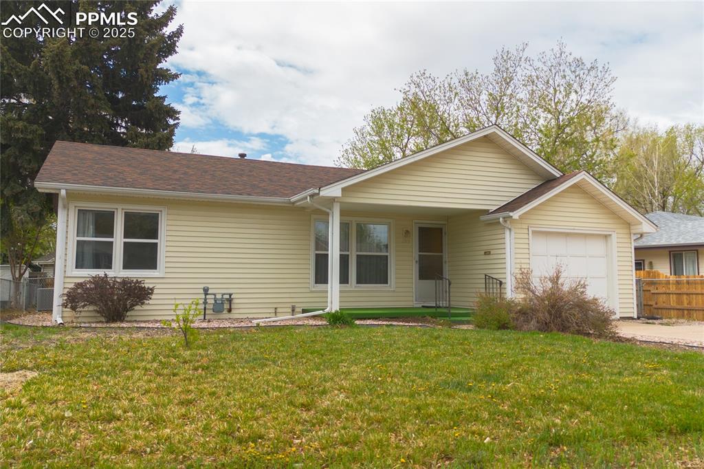 Image 3 of 28: Ranch-style home with covered porch entrance