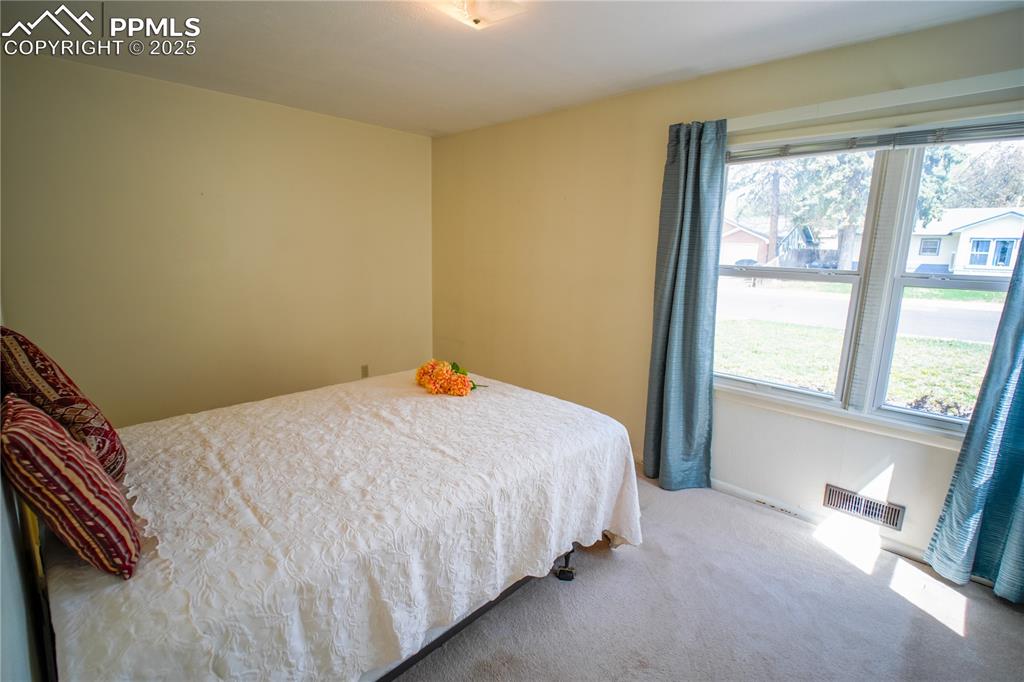 Image 8 of 28: Primary bedroom showing view to front of the home