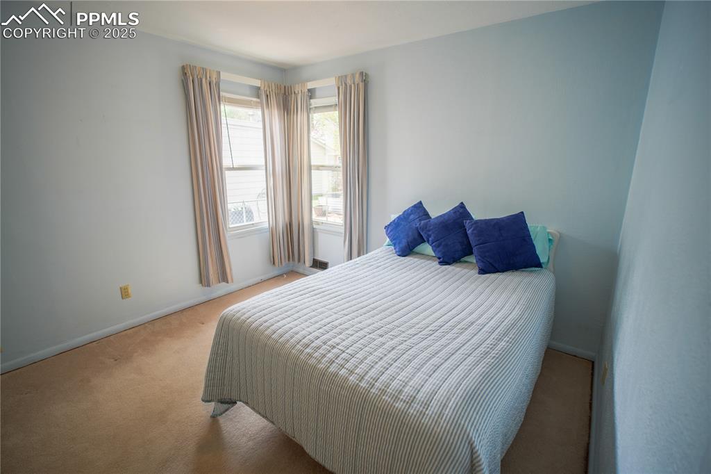 Image 9 of 28: 2nd Bedroom has corner windows allowing nat