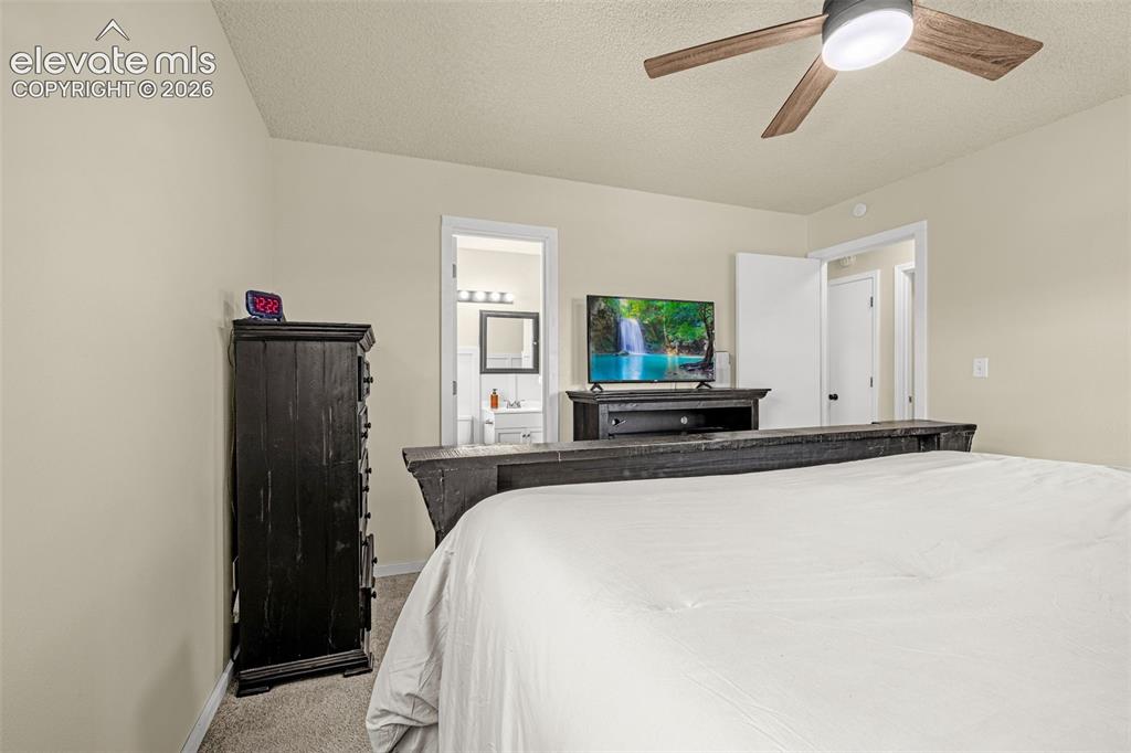 Image 14 of 29: Bedroom featuring neutral wall paint and carpet flooring