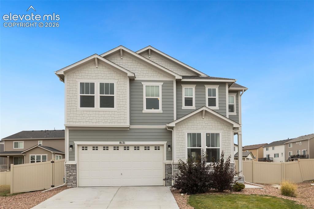 Image 1 of 27: Two-story residence featuring light gray siding, white shake shingles, and