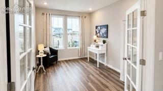 Image 12 of 27: Primary level bedroom or office space. Tall ceilings, recessed lighting, LV