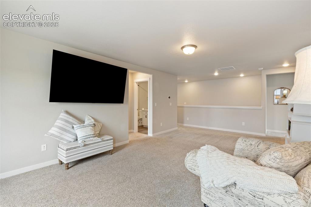 Image 15 of 27: Spacious area useful for a media space, play room & more. Large closet in t