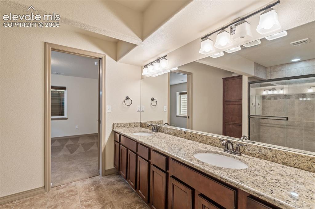 Image 27 of 43: Dual adjoining basement bathroom