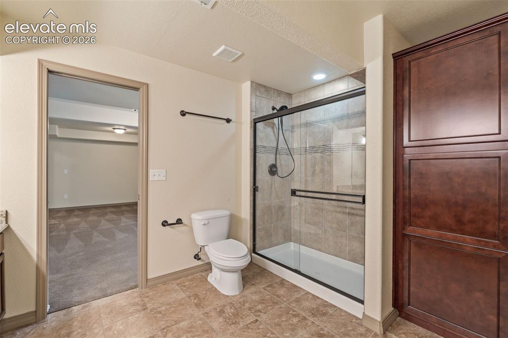 Image 28 of 43: Dual adjoining basement bathroom