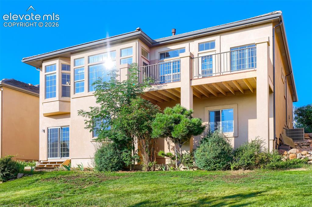 Image 2 of 32: Light-filled walkout finished basement offers 9-ft ceilings & gorgeous view