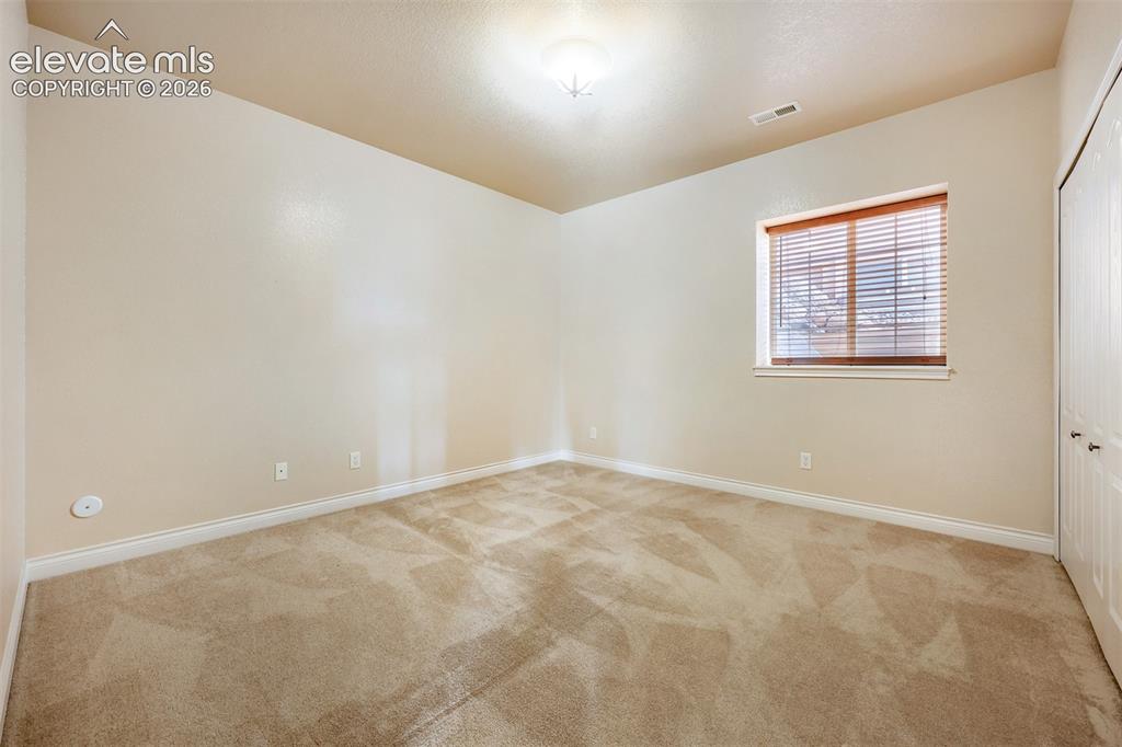 Image 22 of 32: Basement third bedroom