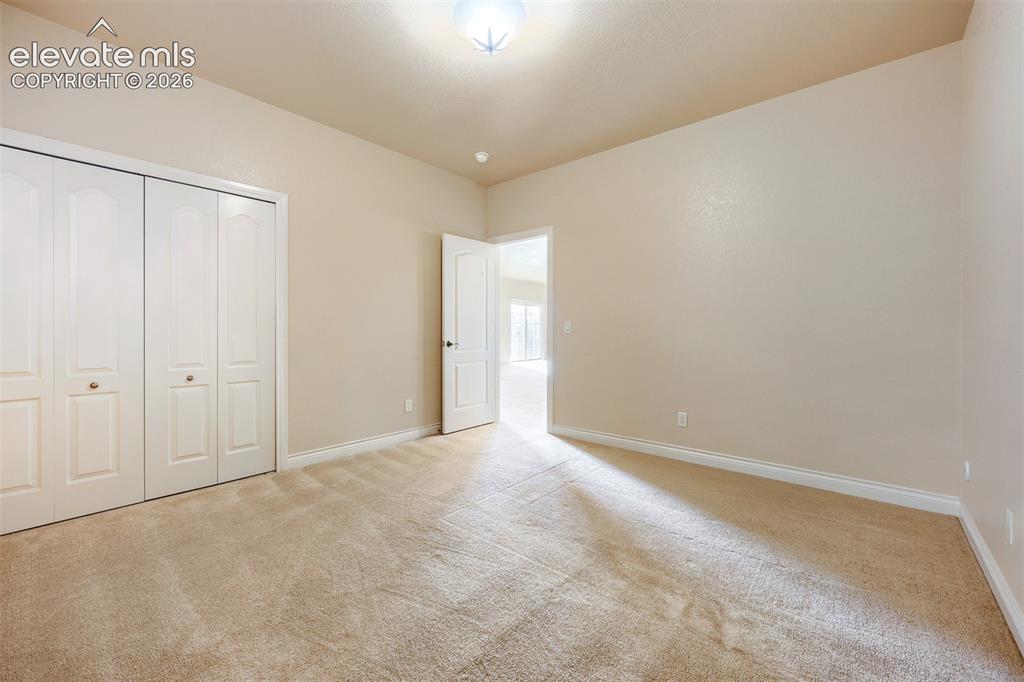 Image 23 of 32: Basement third bedroom