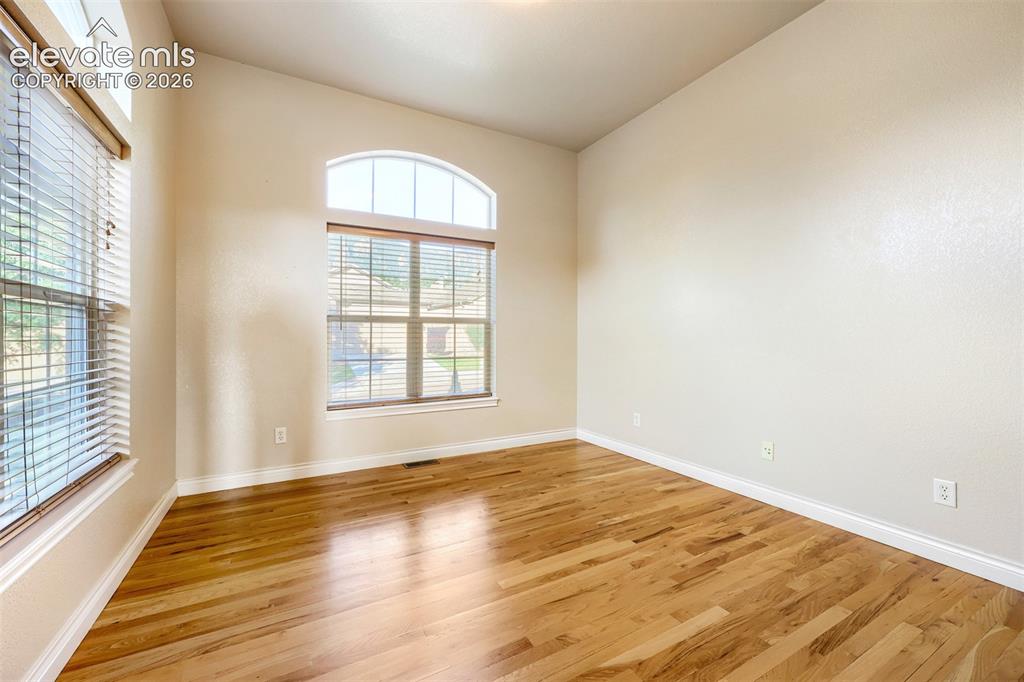 Image 5 of 32: Front office or fourth bedroom with amazing Cheyenne Mountain views