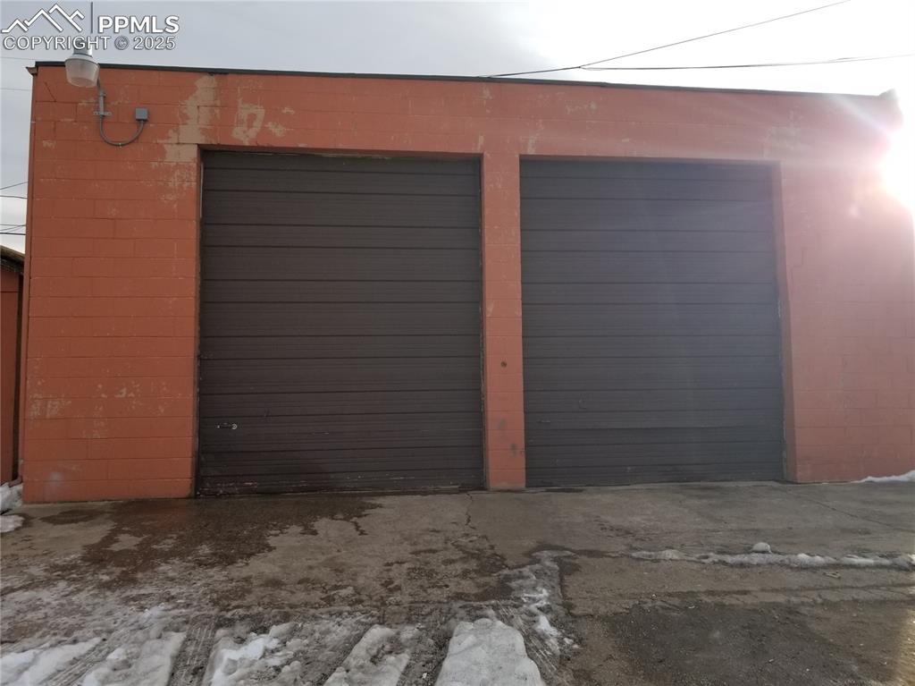 Image 6 of 14: View of snow covered garage