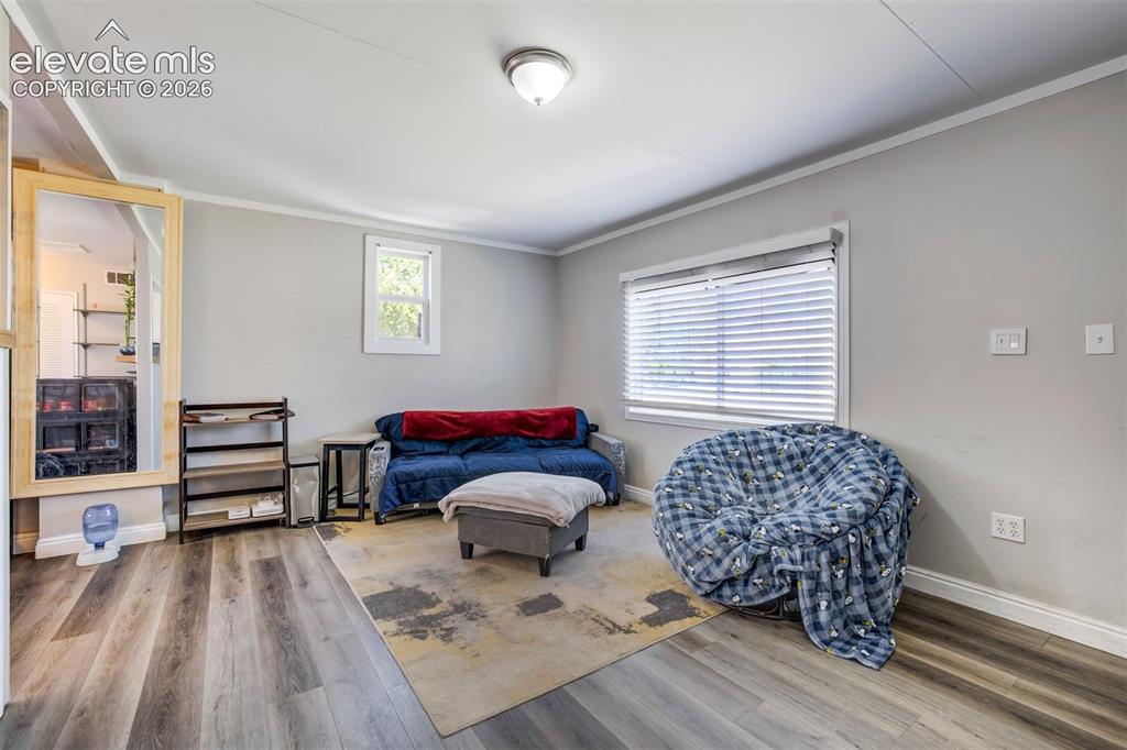 Image 5 of 29: Spacious living room with luxury vinyl flooring