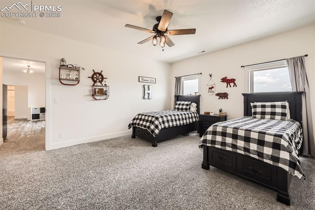 Image 19 of 29: Bedroom featuring carpet and a ceiling fan