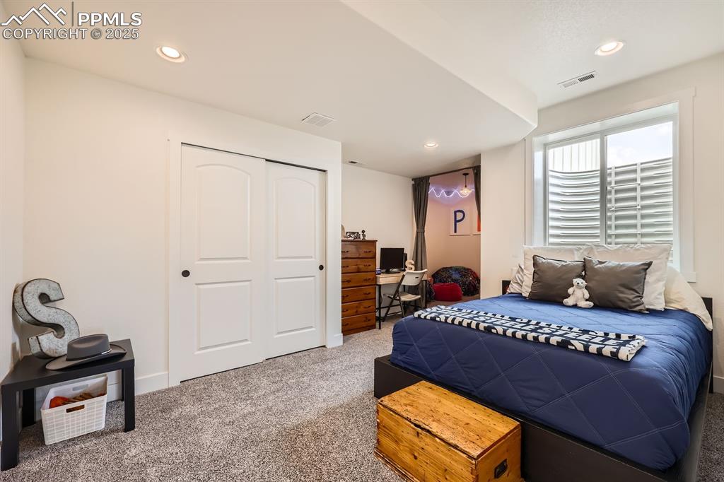 Image 21 of 29: Bedroom featuring carpet floors, a closet, and recessed lighting