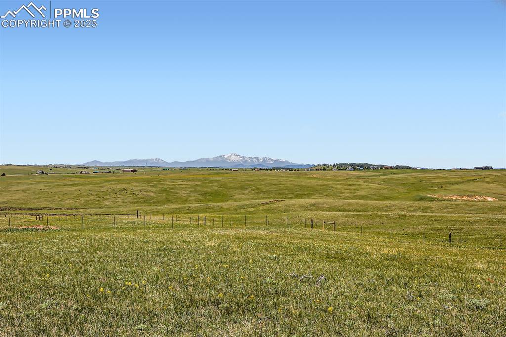 Image 29 of 29: Mountain view with rural landscape and agricultural land