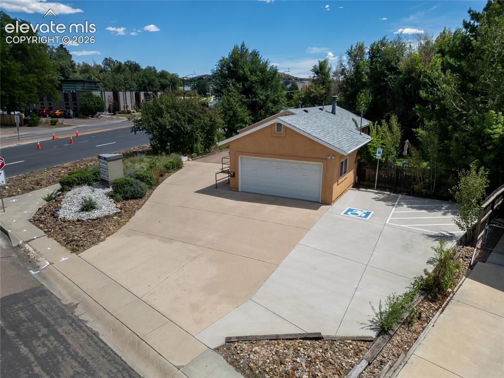 Image 31 of 35: Attached garage, great for work space or parking