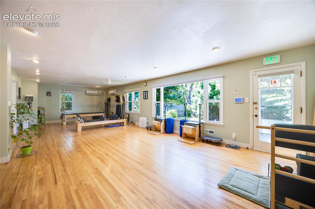 Image 7 of 35: Open, bright space for a fitness user or bullpen office or showroom