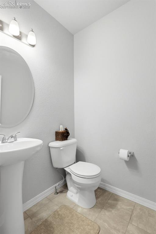 Image 17 of 47: Half bathroom on main floor