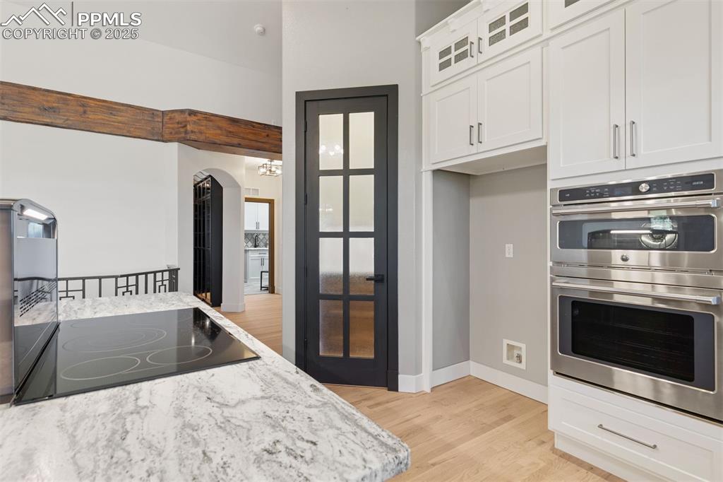 Image 15 of 50: Newly remodeled kitchen with center island cooktop