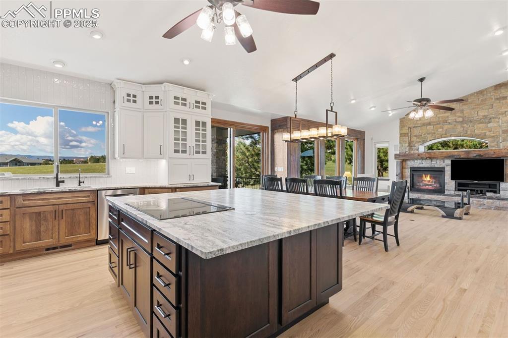 Image 3 of 50: Stunning leathered granite counters and custom cabinetry