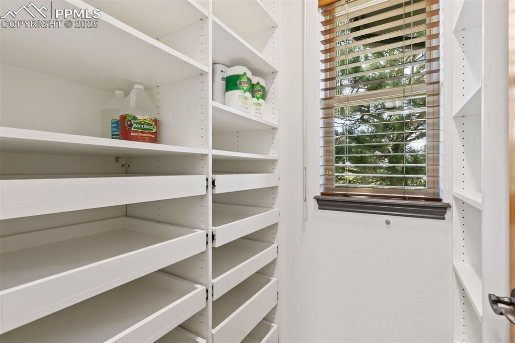 Image 33 of 50: The second pantry space has rollout shelves