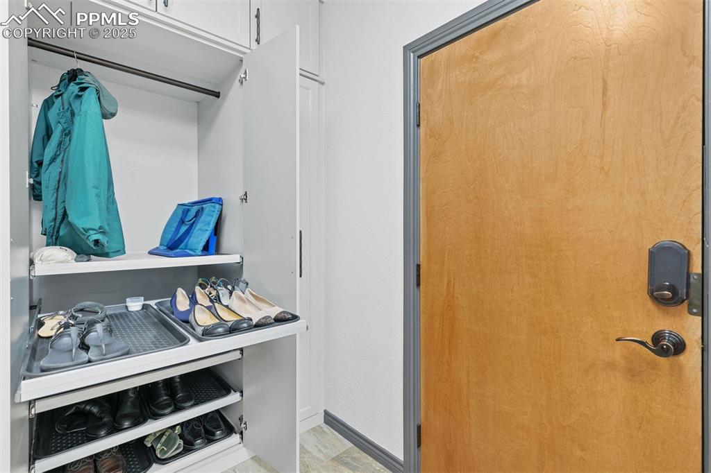 Image 34 of 50: Perfectly designed coat and shoe storage