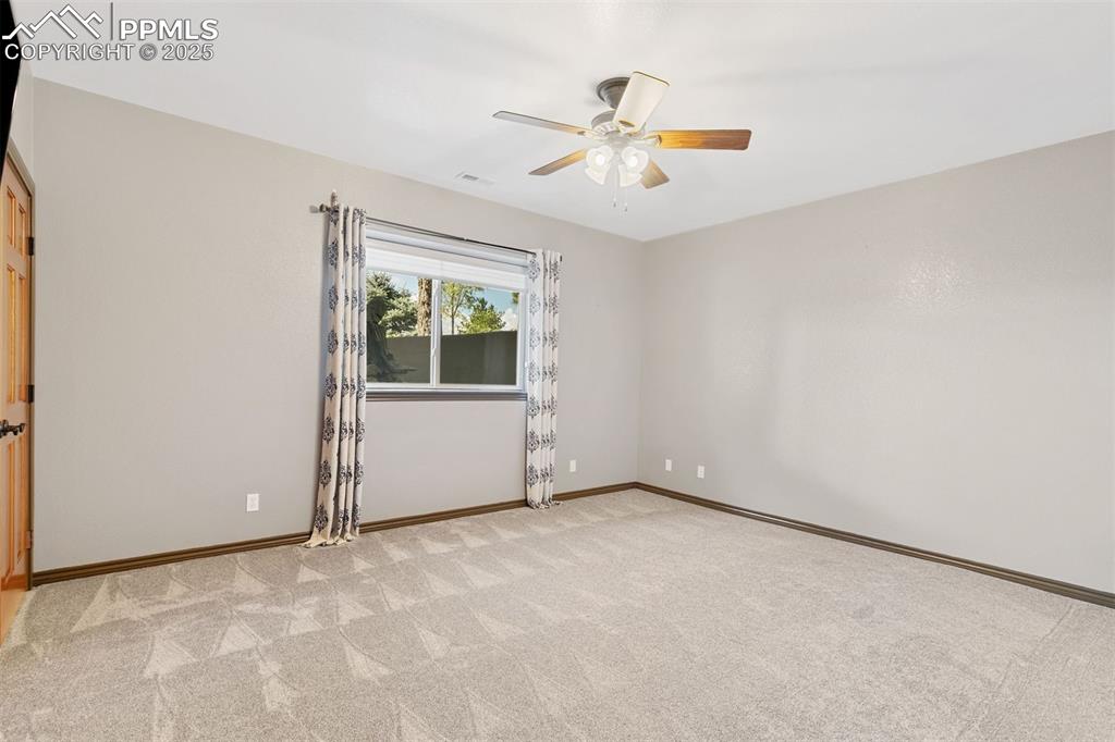 Image 42 of 50: Basement bedroom