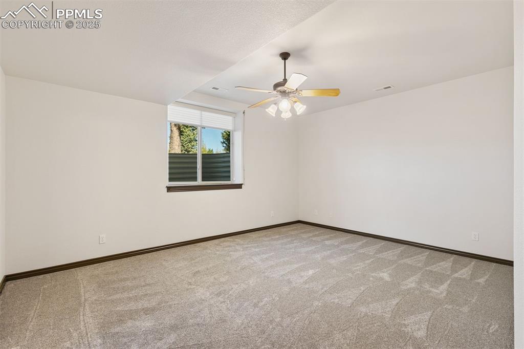 Image 47 of 50: Basement bedroom