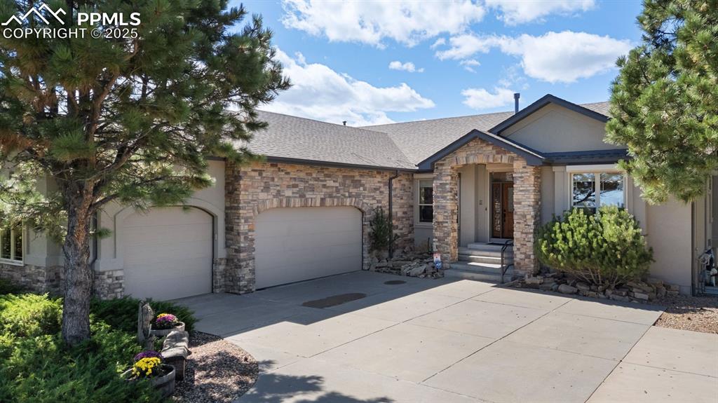 Image 49 of 50: spacious 3 car garage with added parking
