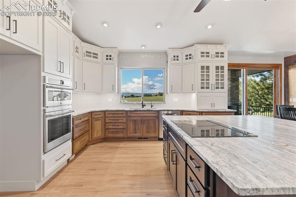 Image 9 of 50: Stylish custom cabinetry with tons of storage