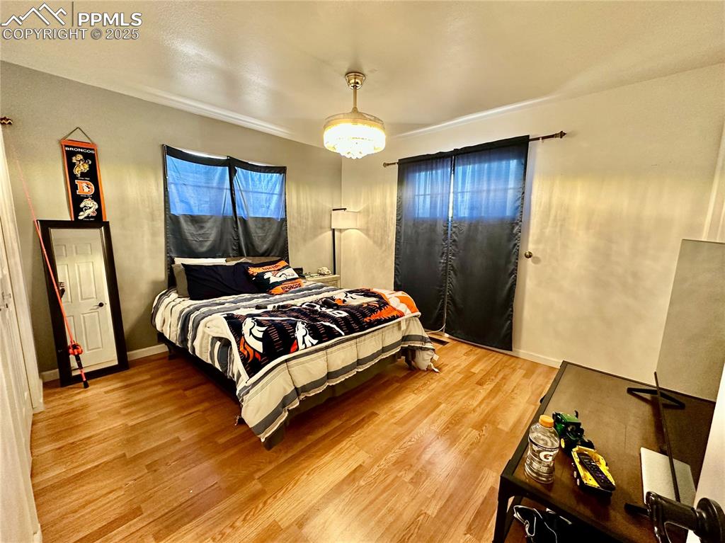 Image 13 of 20: Bedroom featuring light wood-style floors
