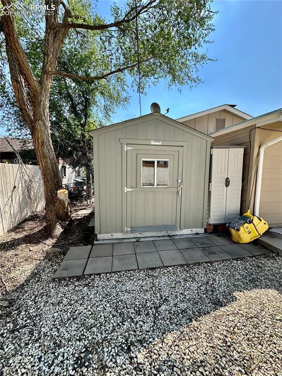 Image 18 of 20: View of shed featuring fence