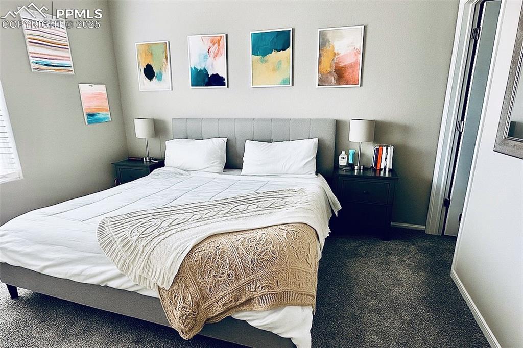 Image 14 of 22: Primary Bedroom with Seller decor before move out