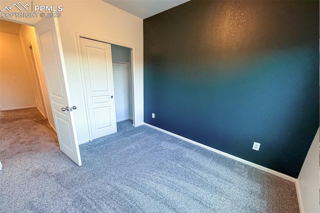 Image 17 of 22: Secondary bedroom with Mt. Views-current