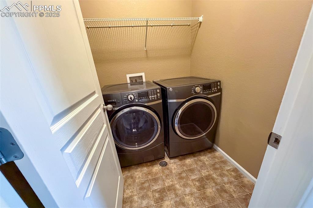 Image 19 of 22: Laundry room located next to Primary bedroom