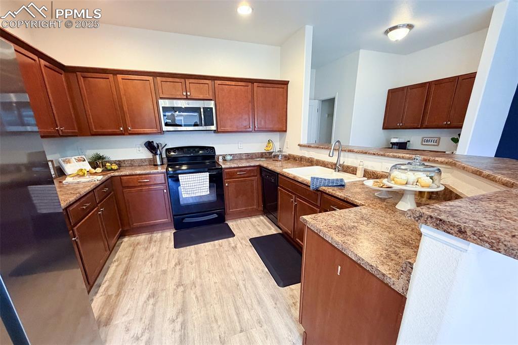 Image 6 of 22: Kitchen with lots of counter and cabinet space; coffee bar with cabinets on