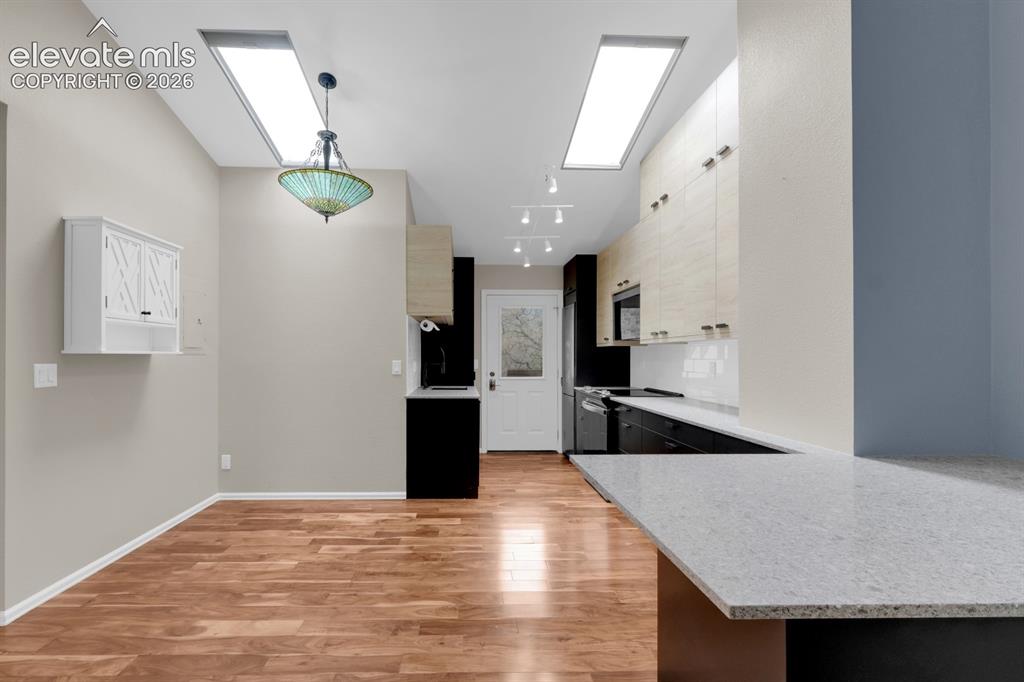 Image 10 of 32: Kitchen and dining area 