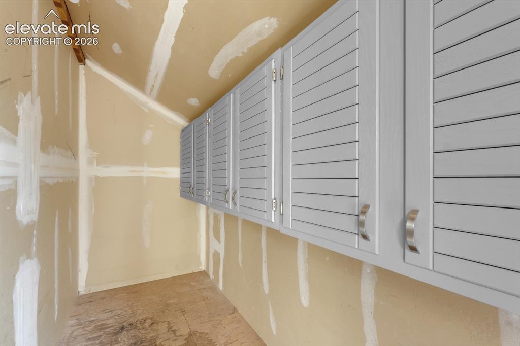 Image 21 of 32: Storage Closet with cabinets