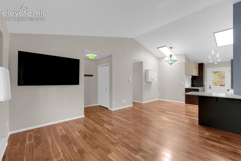 Image 9 of 32: Spacious living room with high ceilings 