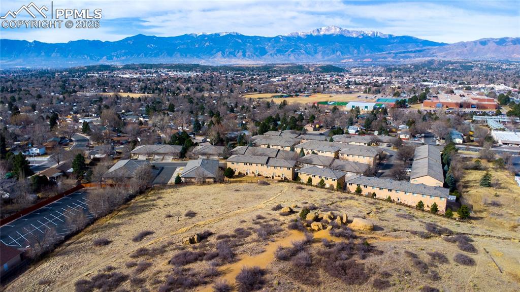 Image 29 of 30: Aerial view of community, open space, and gorgeous Pikes Peak and mountain 