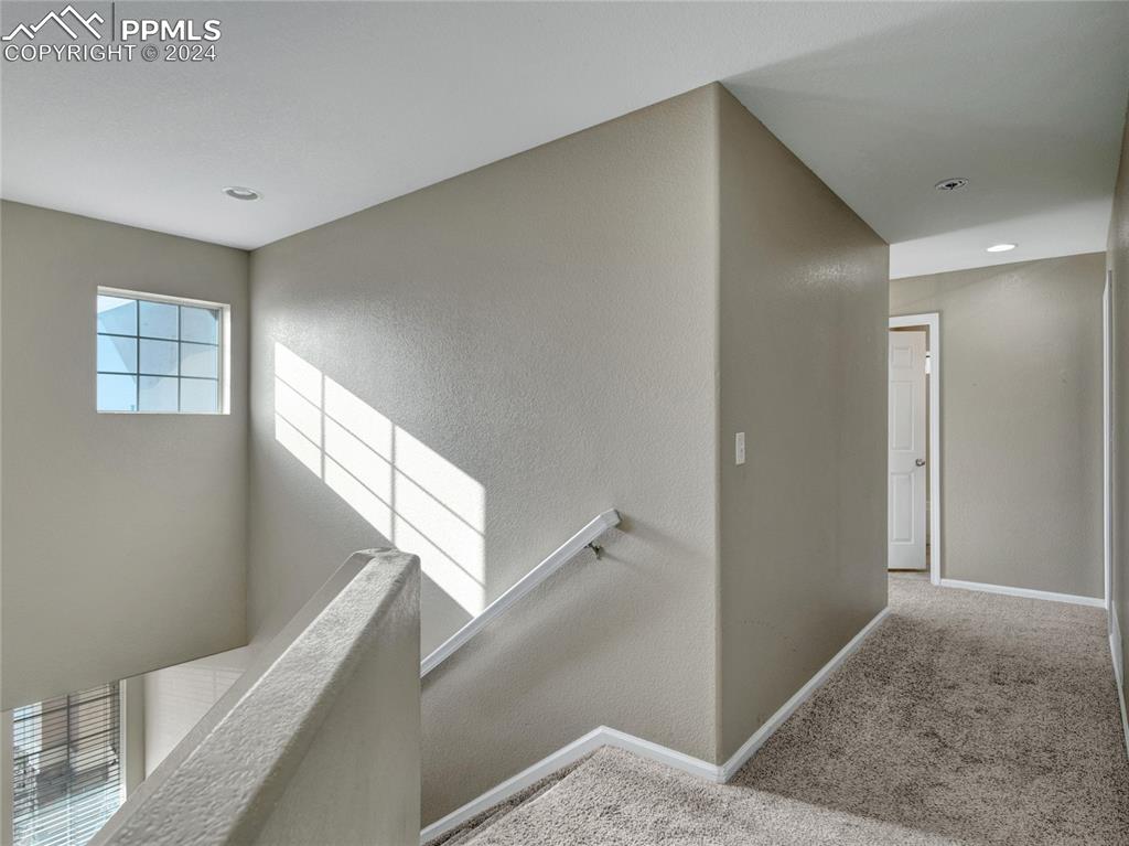 Image 11 of 23: Staircase featuring carpet
