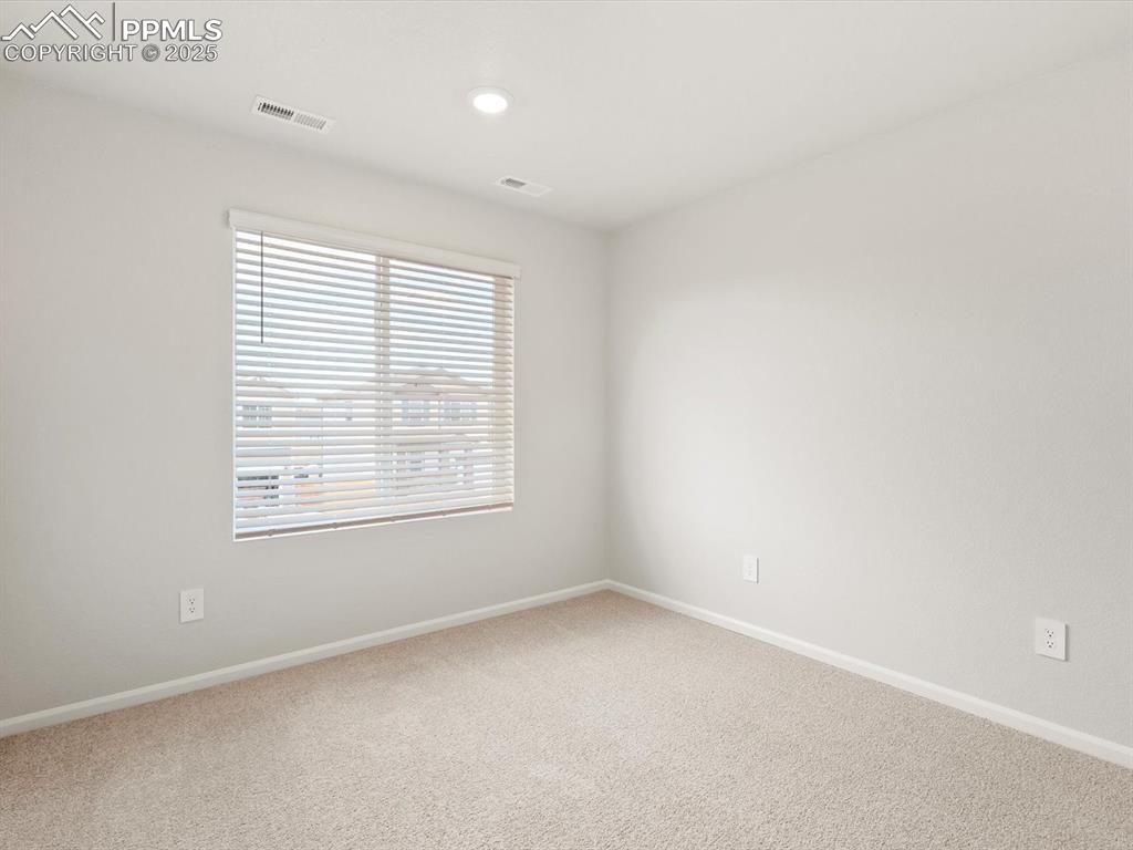 Image 15 of 23: Empty room featuring light carpet and recessed lighting