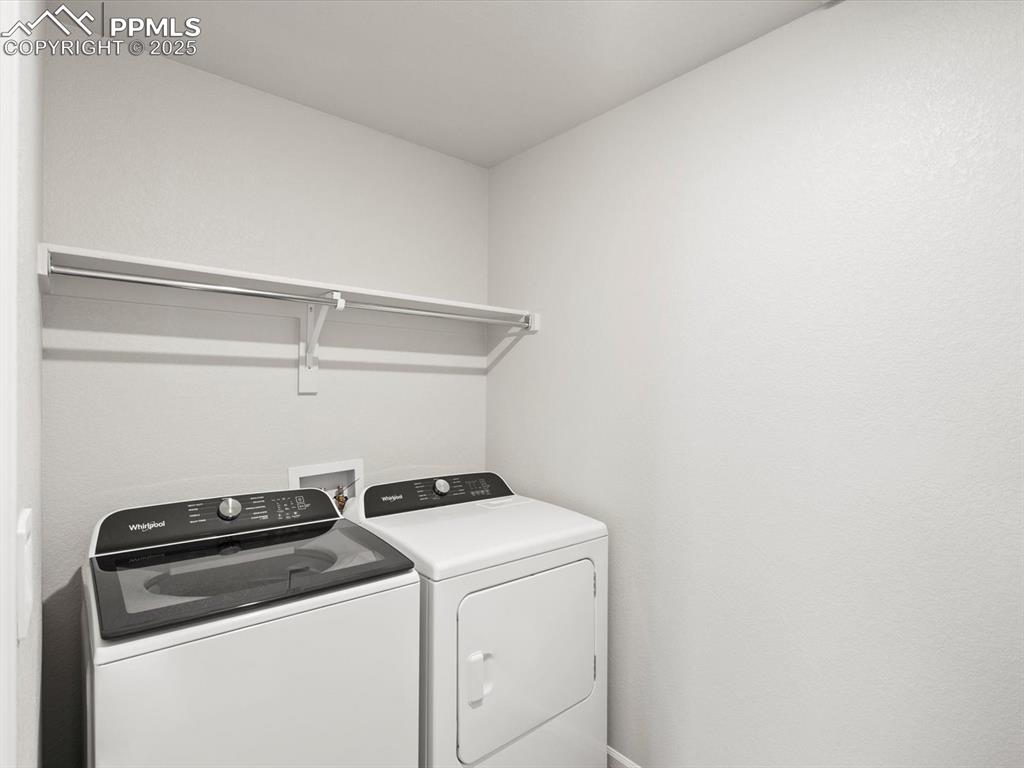 Image 17 of 23: Washroom with washing machine and dryer