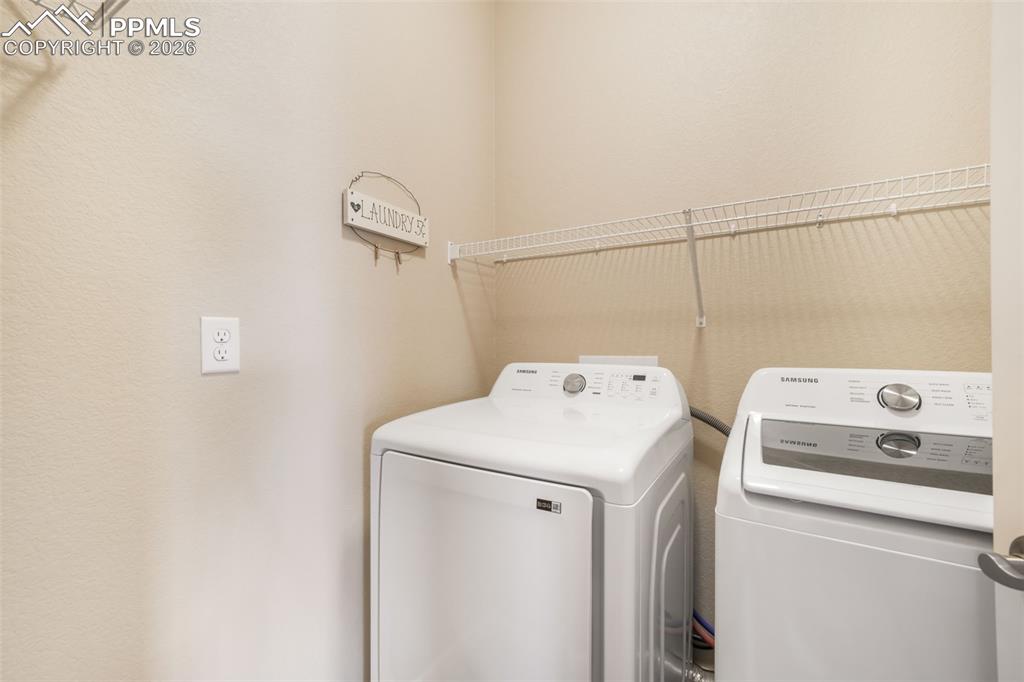 Image 19 of 50: Kitchen featuring light wood-finish cabinetry, stainless steel appliances, 
