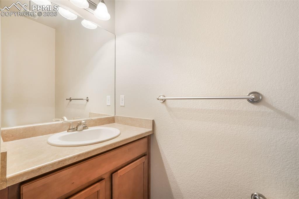 Image 20 of 50: Kitchen island featuring a double-basin sink, stainless steel dishwasher, a